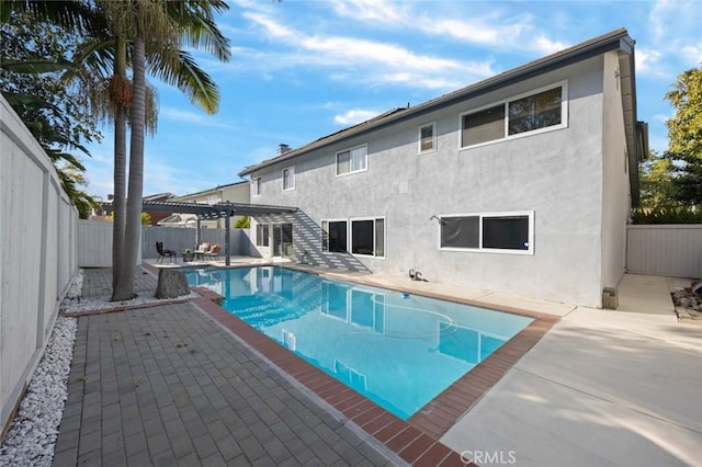 view of pool featuring a patio area and a pergola