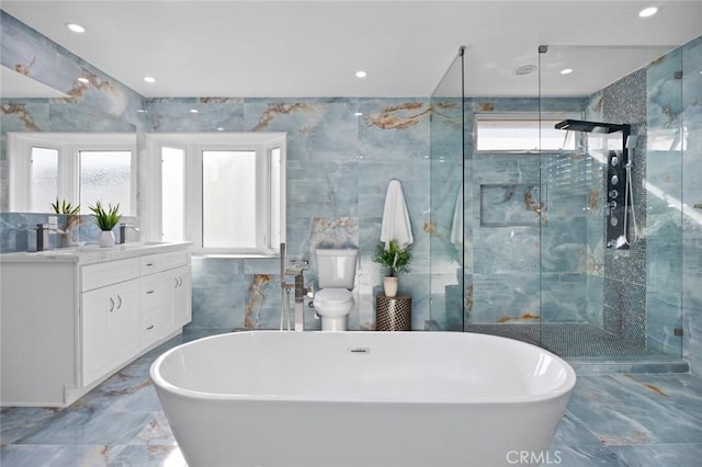 bathroom featuring vanity, tile walls, and independent shower and bath