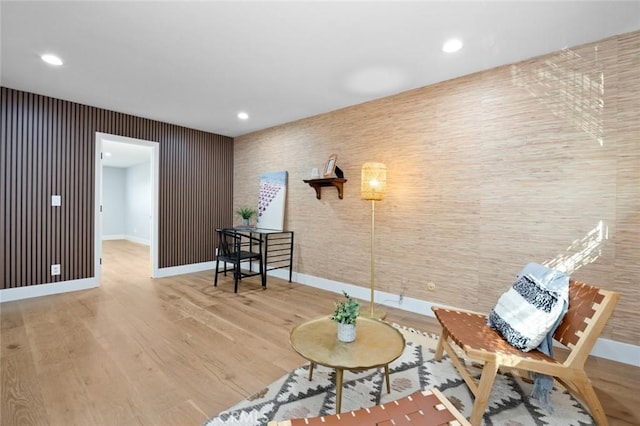 sitting room with hardwood / wood-style floors