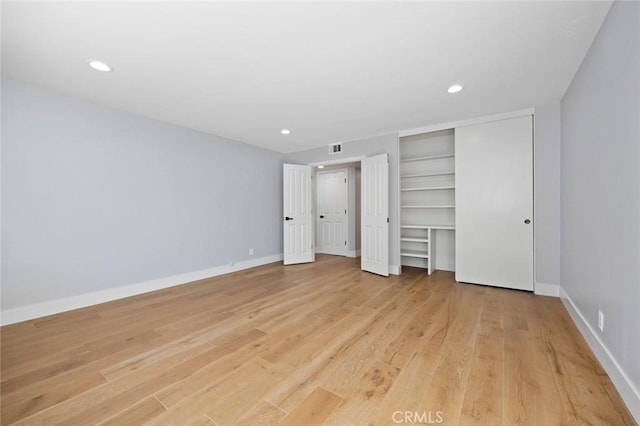 unfurnished bedroom with light hardwood / wood-style floors