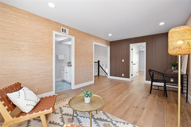 sitting room with hardwood / wood-style floors