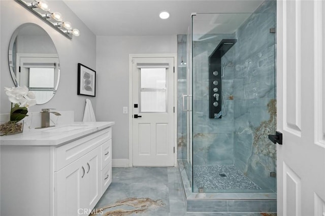 bathroom featuring vanity and an enclosed shower