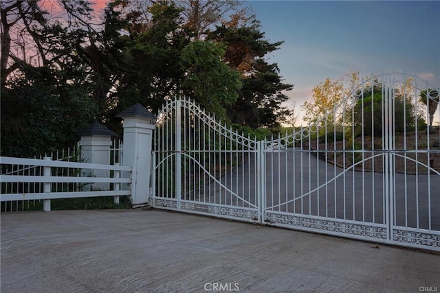 view of gate at dusk