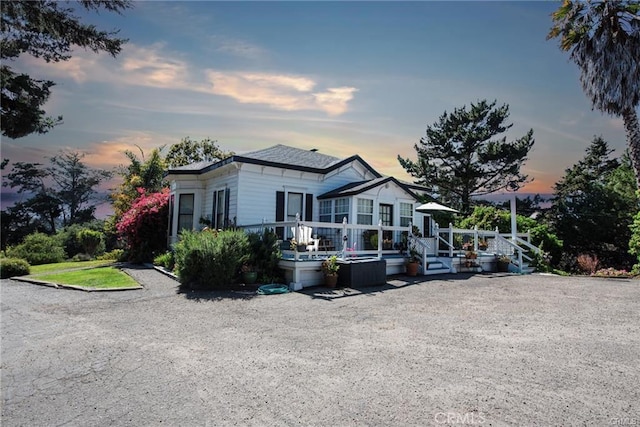 view of front of house with a wooden deck