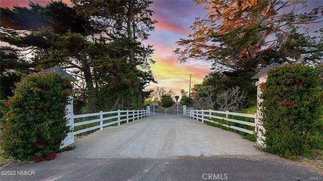 view of gate at dusk