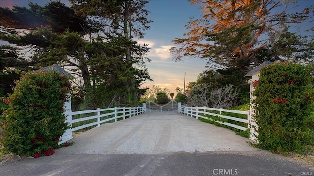 view of gate at dusk