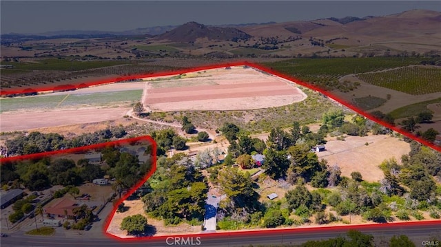 aerial view with a mountain view and a rural view