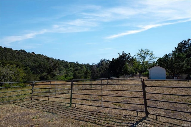 1680 Los Berros Rd, Arroyo Grande, CA 93420 - gate featuring a wooded view and an outbuilding
