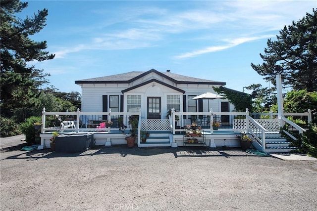 back of property featuring a deck