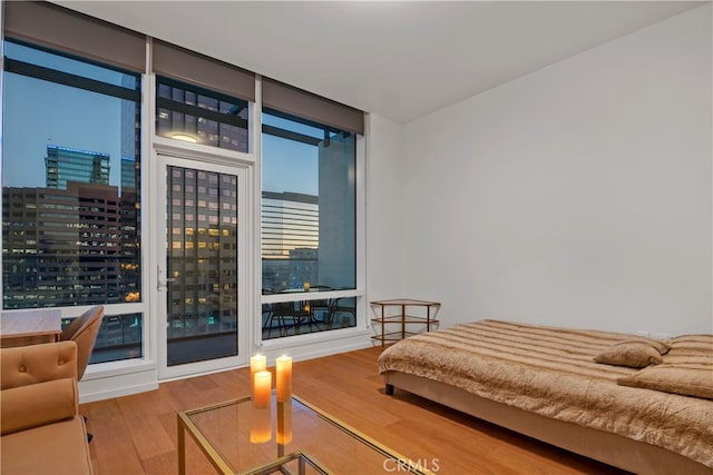 bedroom with hardwood / wood-style flooring