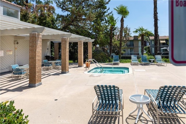 view of swimming pool featuring a patio area and a pergola