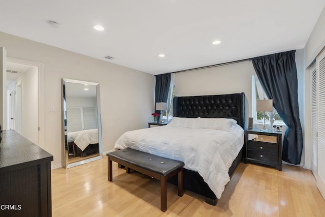 bedroom featuring a closet and light wood-type flooring