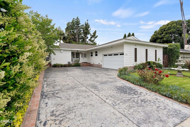 ranch-style home with a garage