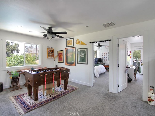 recreation room featuring ceiling fan and carpet floors