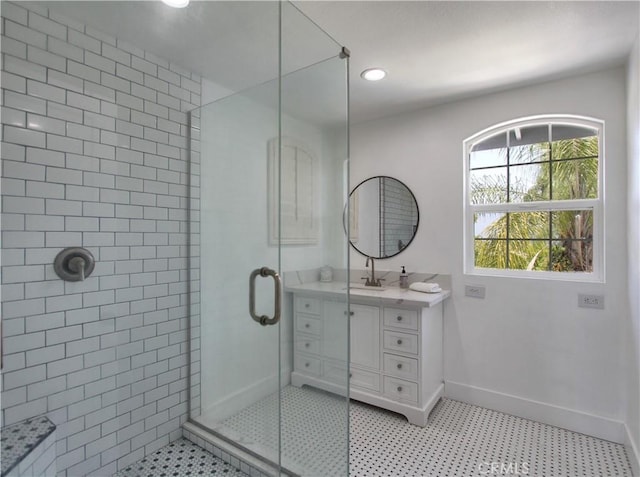 bathroom with tile patterned floors, vanity, and an enclosed shower