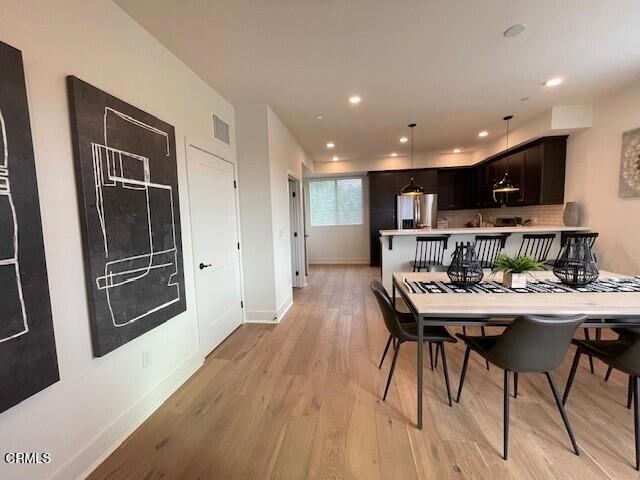 dining room featuring light hardwood / wood-style floors