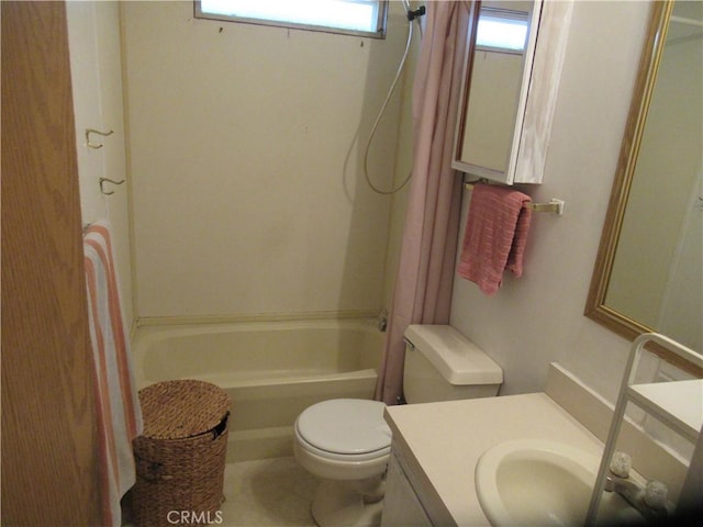 full bathroom featuring toilet, vanity, and shower / washtub combination