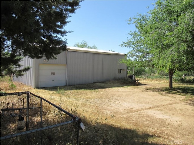 view of outbuilding with a garage