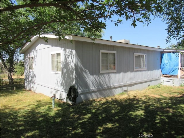 view of property exterior with a yard