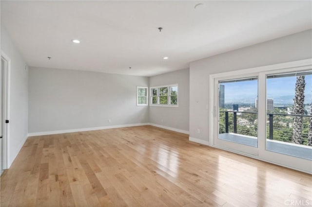 unfurnished room featuring light hardwood / wood-style floors