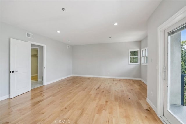 unfurnished room featuring light hardwood / wood-style flooring