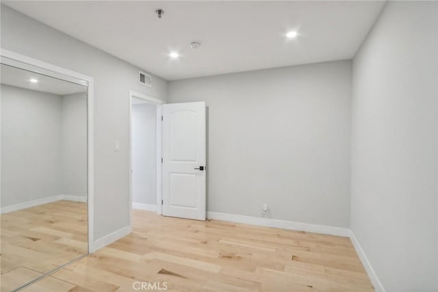 unfurnished bedroom with light hardwood / wood-style flooring