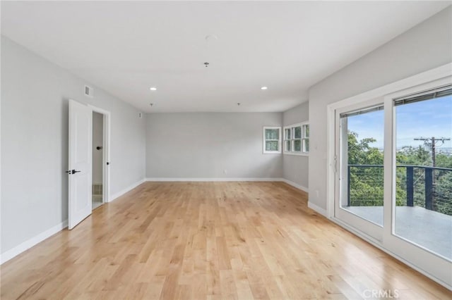 unfurnished room featuring light wood-type flooring