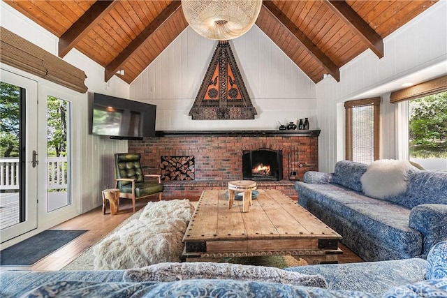 living room with wooden ceiling, hardwood / wood-style floors, and a healthy amount of sunlight