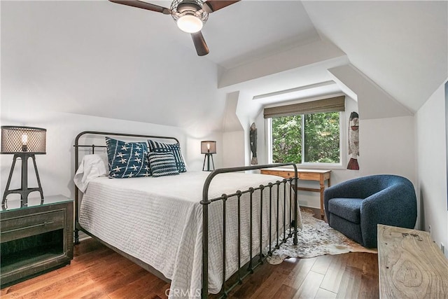 bedroom featuring hardwood / wood-style flooring, vaulted ceiling, and ceiling fan