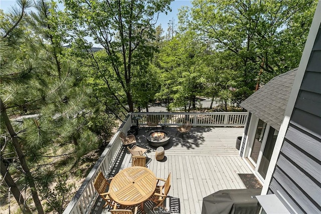 wooden terrace with area for grilling