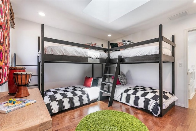 bedroom with wood-type flooring