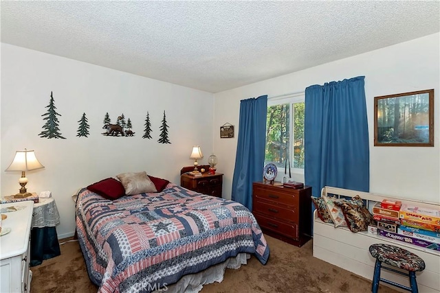 bedroom featuring a textured ceiling and carpet floors