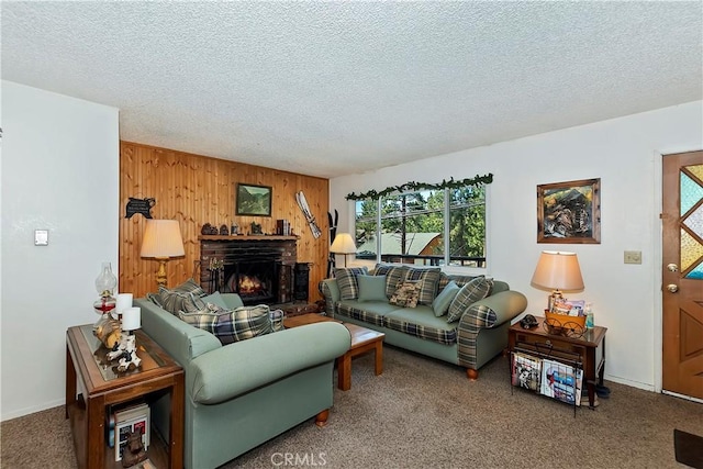 living room featuring carpet floors, a brick fireplace, wood walls, and a textured ceiling