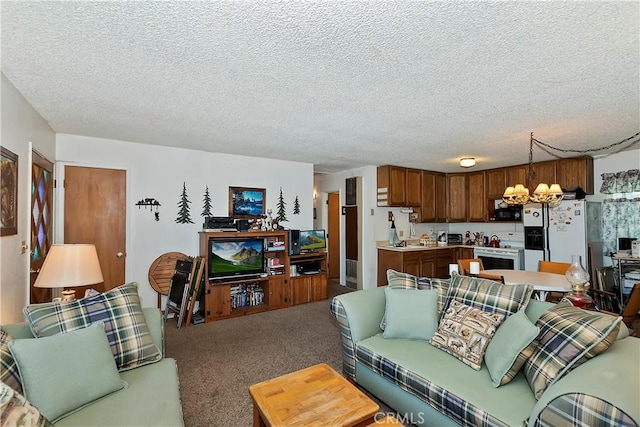 living room featuring a textured ceiling, carpet, and a chandelier