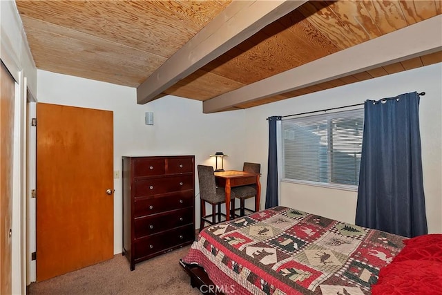 carpeted bedroom with beamed ceiling and wood ceiling