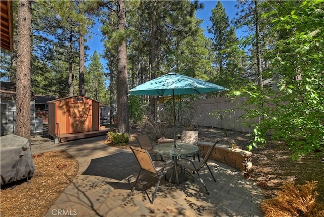 view of patio featuring a storage shed