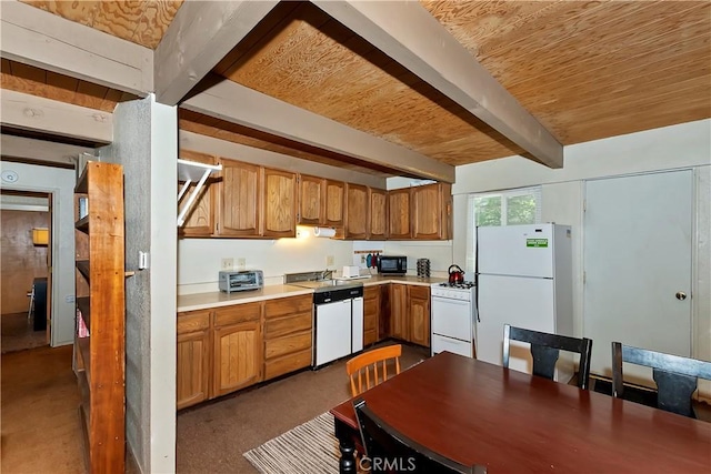 kitchen featuring beamed ceiling and white appliances