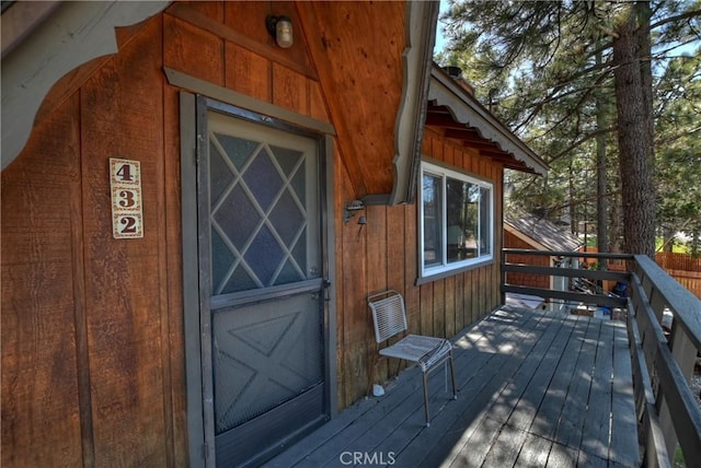 property entrance with a wooden deck