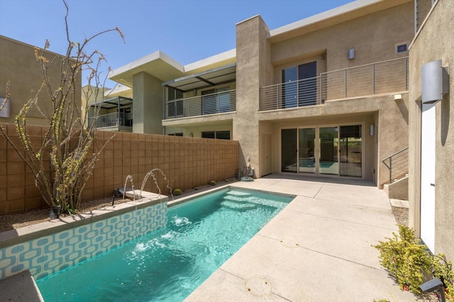 view of swimming pool featuring a patio and pool water feature