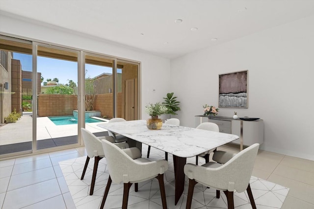 dining area featuring light tile patterned floors