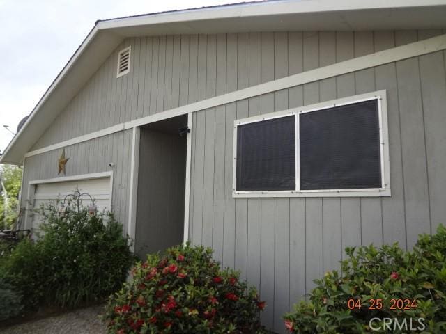 view of side of property with a garage