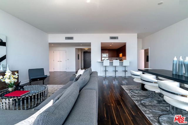 living room featuring wood-type flooring