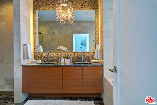 bathroom featuring separate shower and tub, vanity, tile walls, and decorative backsplash