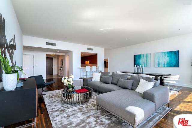 living room featuring dark hardwood / wood-style floors