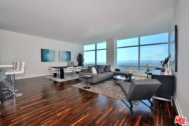 living room with a wall of windows and hardwood / wood-style flooring