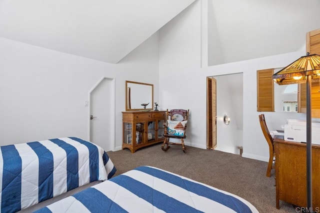 bedroom featuring high vaulted ceiling and carpet floors