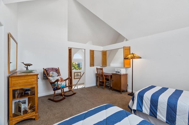 bedroom featuring high vaulted ceiling and carpet