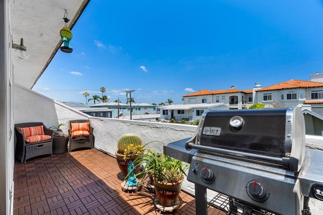 view of patio featuring a balcony and grilling area