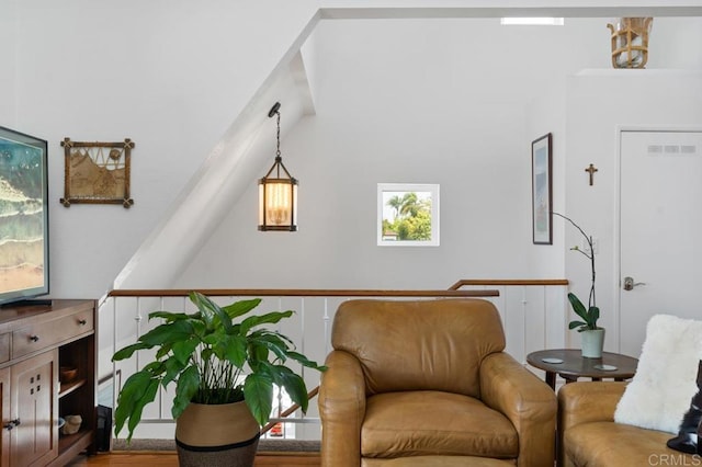 living area with hardwood / wood-style flooring