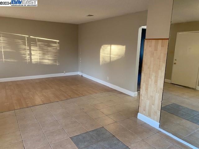 spare room featuring hardwood / wood-style flooring